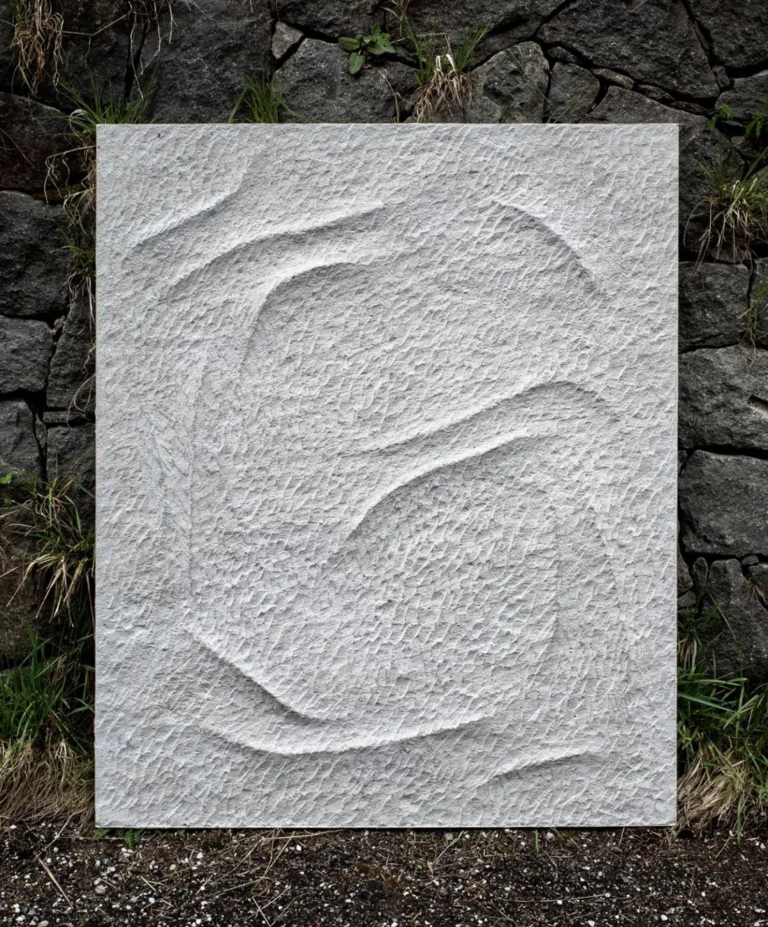 Pale artistic relief photographed outdoors